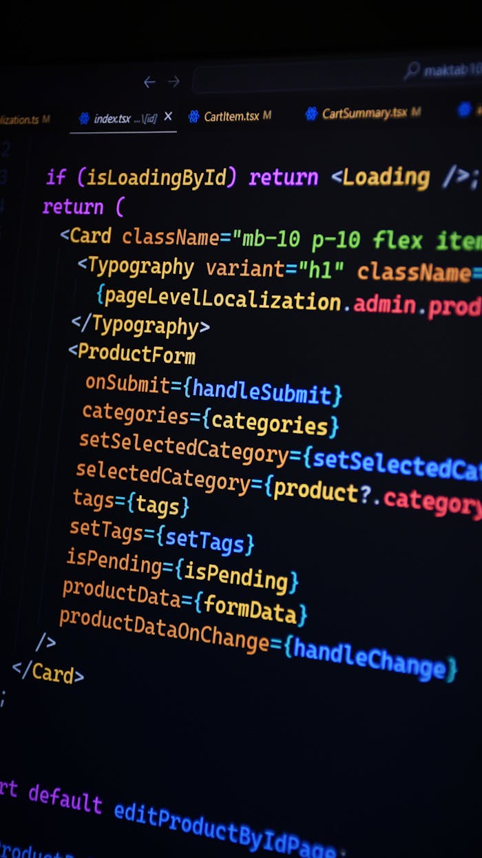 About Close-up of JSX code on a monitor, showcasing colorful syntax used in ReactJS development.